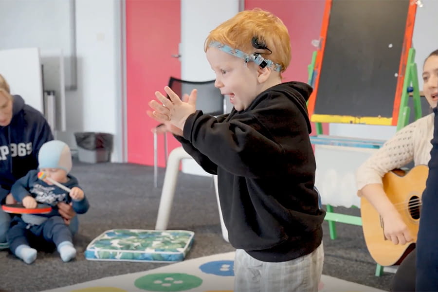 child-clapping-acoustic-skills-cgf-recipient-nsw