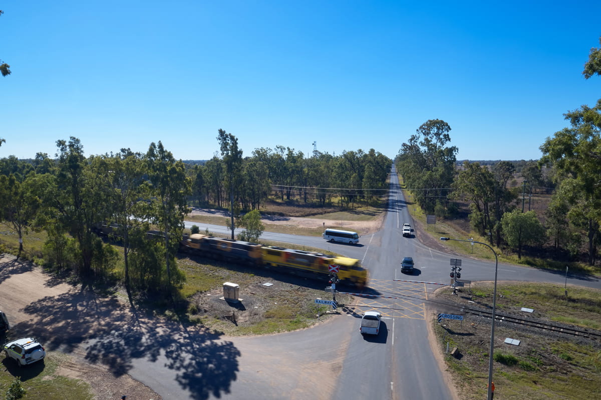 locomotive-moving-through-level-crossing-featured-section