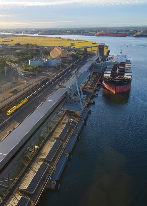 ship-docked-alongside-train-newcastle-featured-card