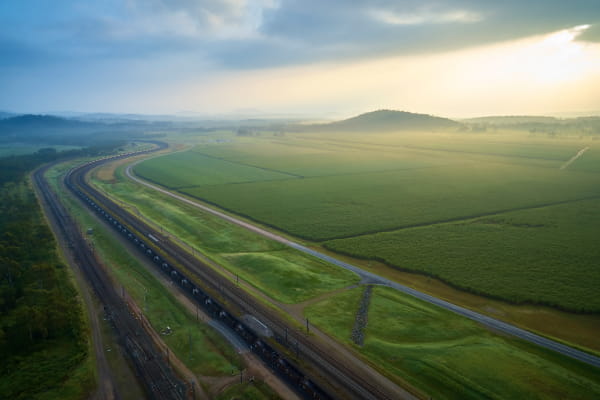 coal-train-moving-through-green-fields-cqcn-card-collection
