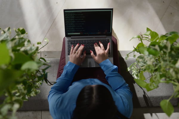 female-writing-media-release-on-laptop